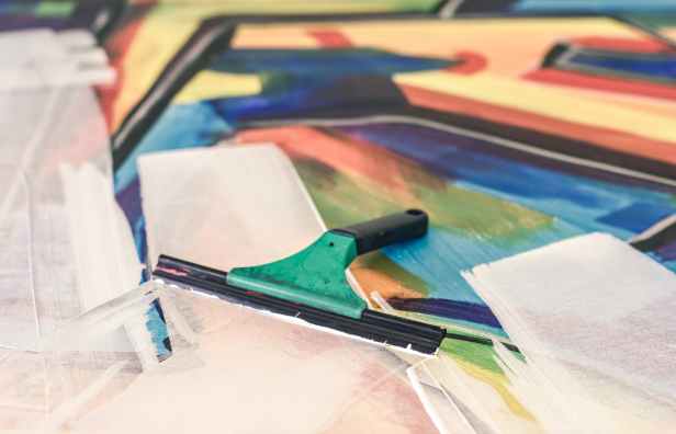 teal and black squeegee